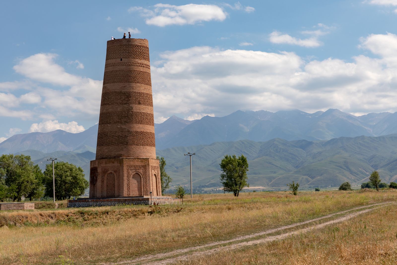 Burana Tower, the brick minaret near Tokmok, with mountains behind